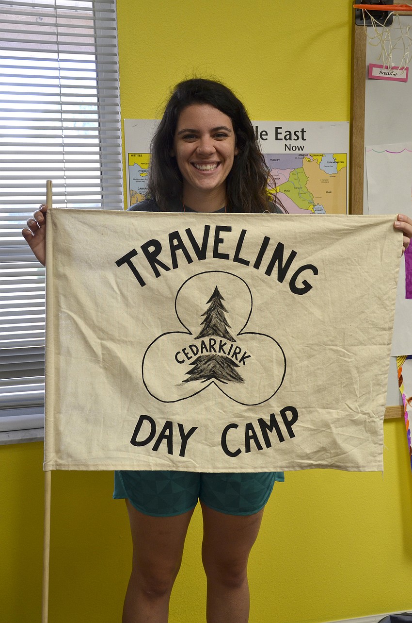 Beca Franca holds up her banner.