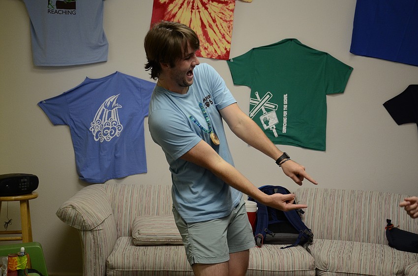 Paul Anderson, camp counselor, starts a game of 