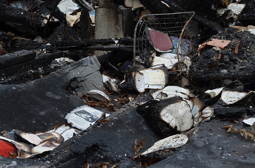 Charred books lay among the rubble.