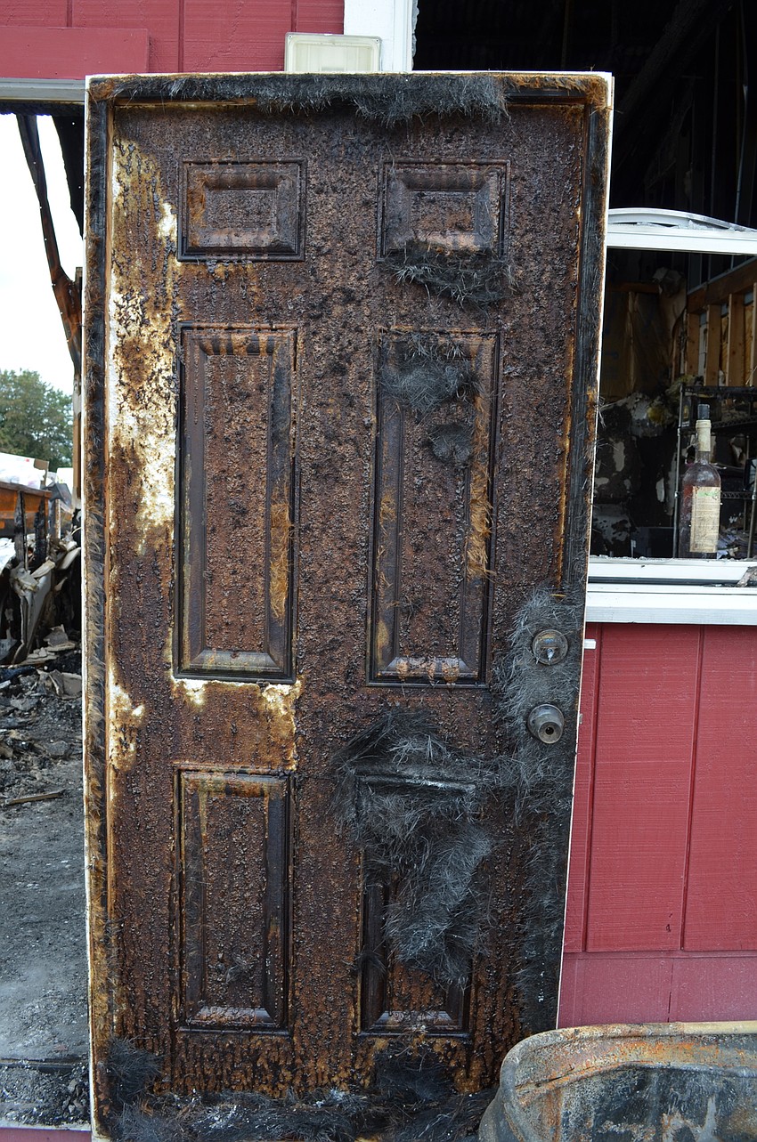 The door to the restaurant’s office was damaged by the fire.