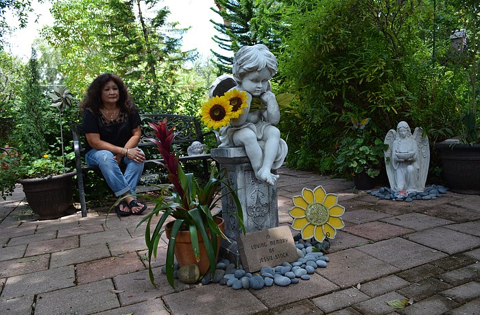 Rose Stock says she prays and thinks of her daughter every day while walking through the garden built in her memory. The garden has been part of Stock's grieving process.