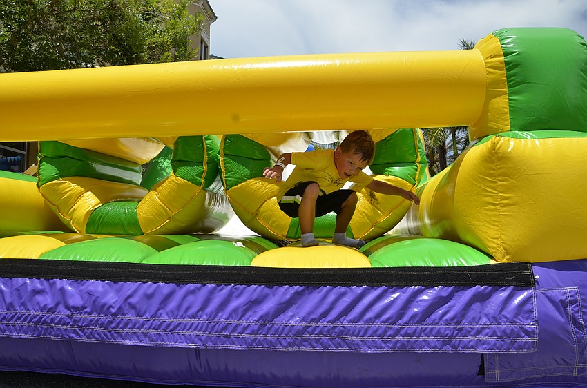 Jett Hawker of Lakewood Ranch successfully completes an inflatable obstacle course.