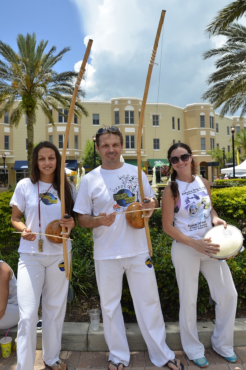 Eliana Osorio, Rajon Ryan and Melissa Ryan played music with a traditional Brazilian instrument called a borimbau. They represented Capoeira Volta ao Mundo, a Brazilian martial arts studio in Sarasota and Lakewood Ranch.
