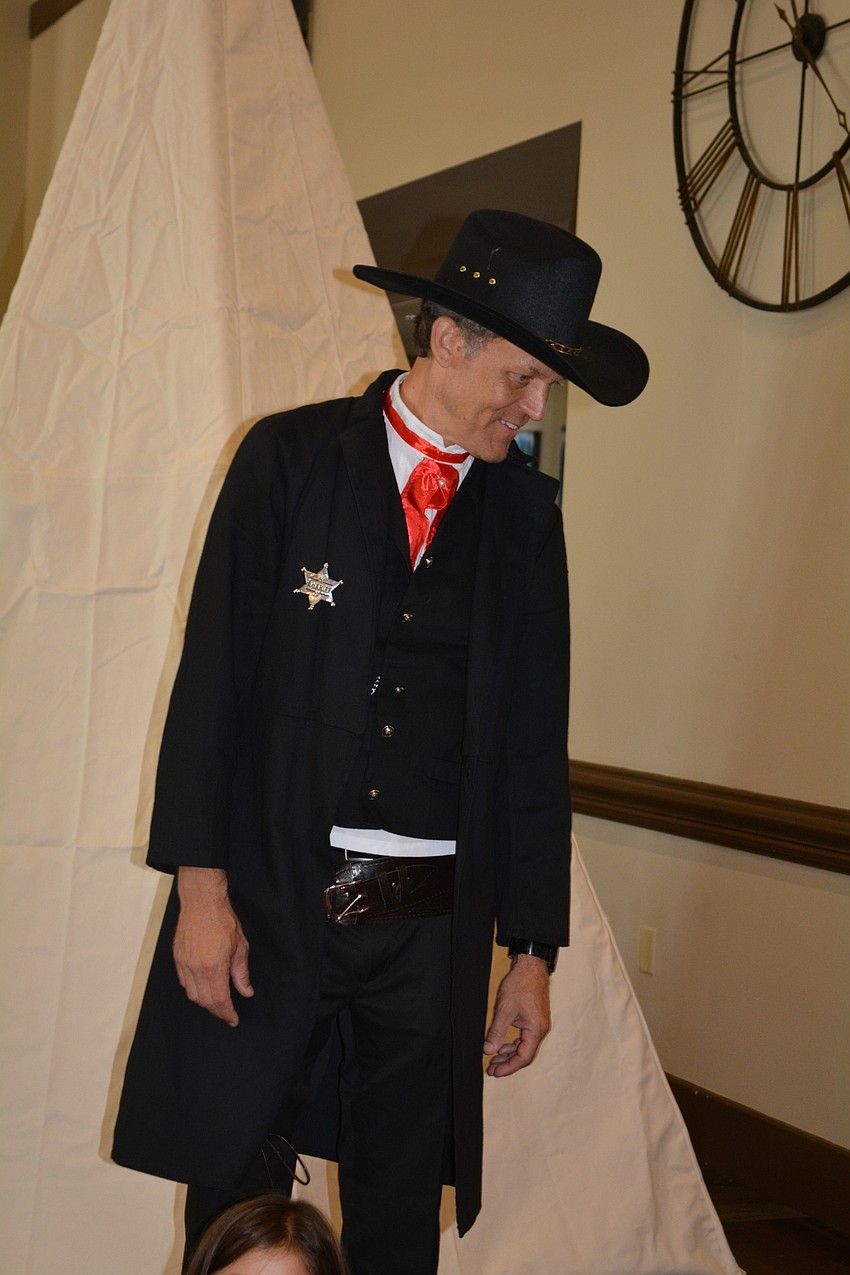 Sheriff Ron Boudrie, associate children's director for the Bayside East Bradenton campus, checks on campers as they snack.