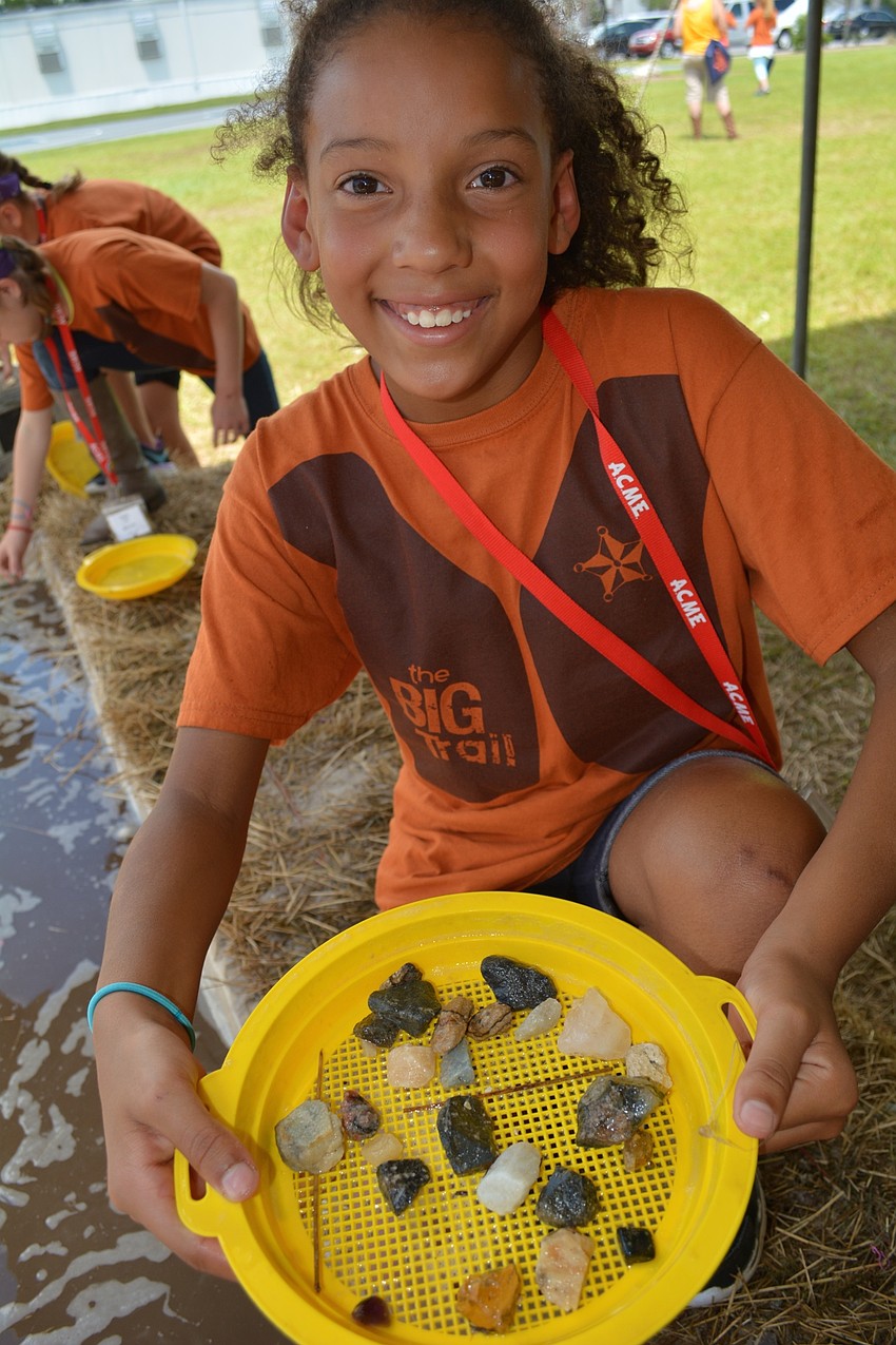 Cadence Andersen sifts sand and water to discover gold nuggets and other rocks and treasures.