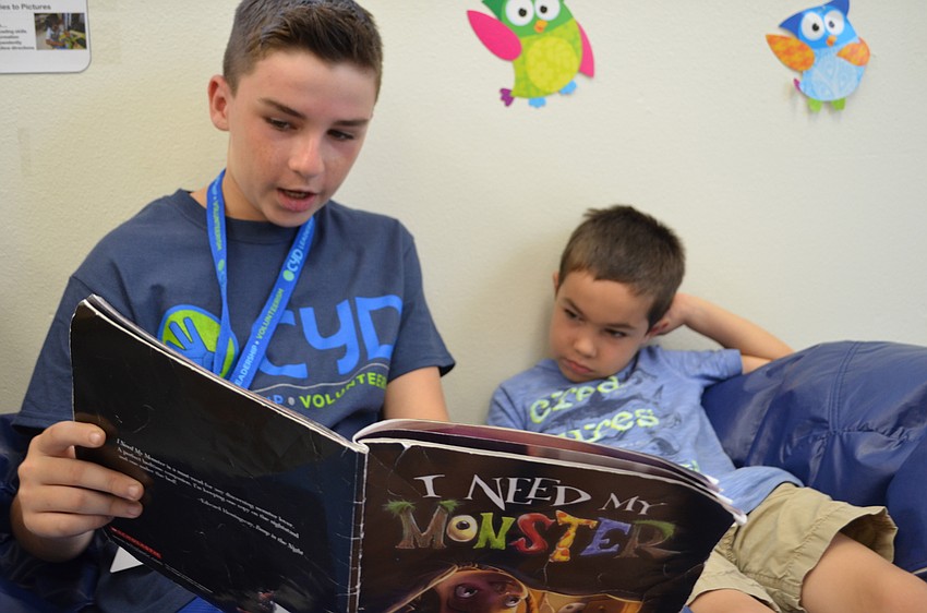 Connor Murphy and Gideon Hersh relax with the book 