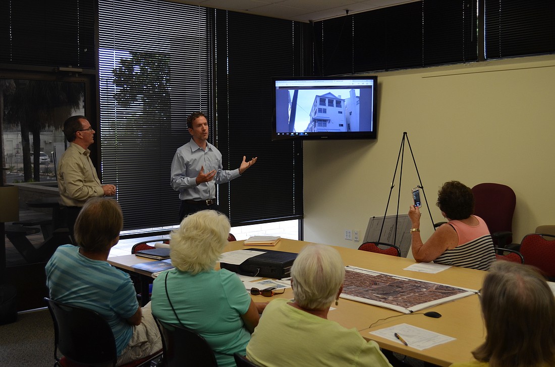 Martin Frame showed residents examples of David Weekley Homes projects in other areas at Tuesday's community workshop.