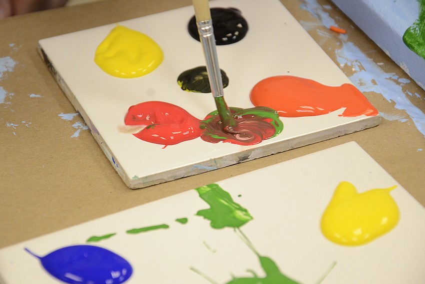 Emily Davis of Sarasota mixes up her colors to make her fish more unique.