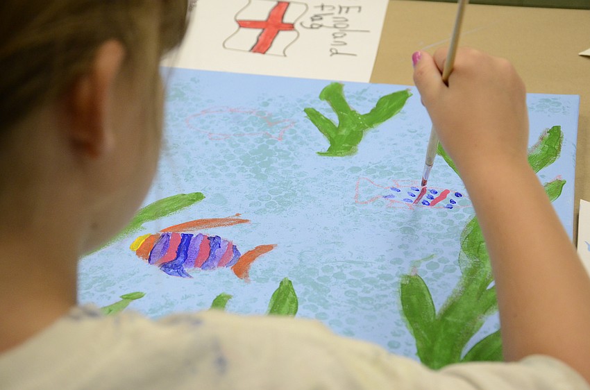 Cate Kitcher puts a few spots on her second fish.