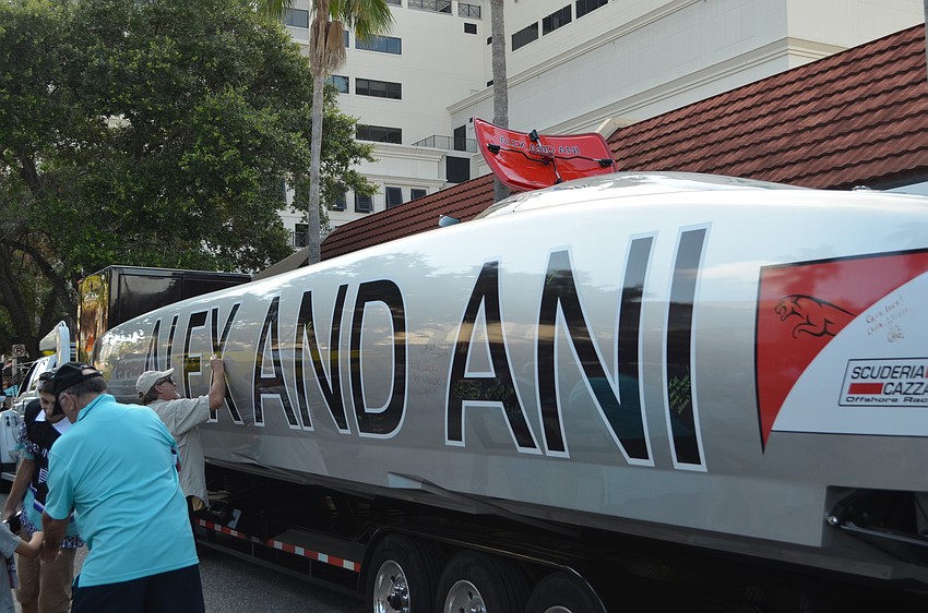 Team Alex and Ani invited fans to sign the boat.