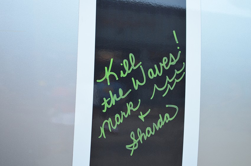 Attendees signed well wishes on the Alex and Ani boat.