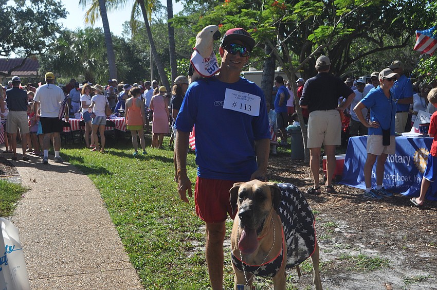 Josh Davis with his parrot, P.J. and dog, Daisy Dukes