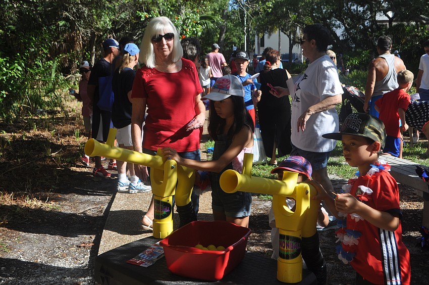Olivia, James and Aidan play some games after the parade
