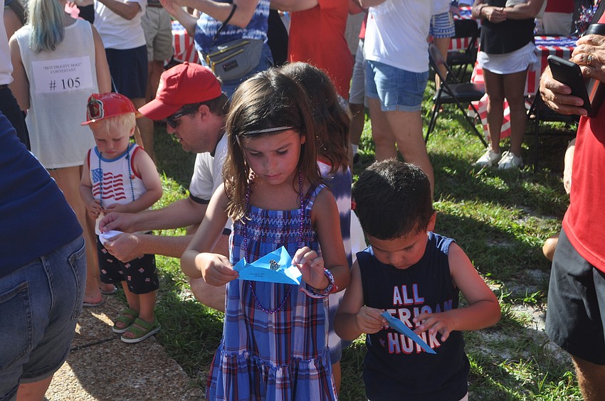 Brooke Raimonde, 7 and brother, Zach, 3, release their butterflies