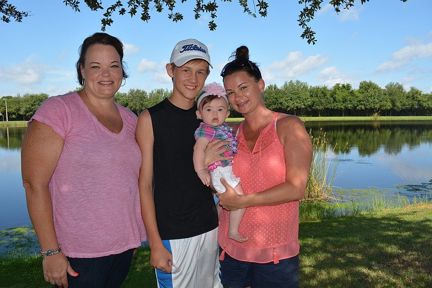 Paula Skarsten attends while visiting friends Kaleb, Addison and Alison Mahlum.