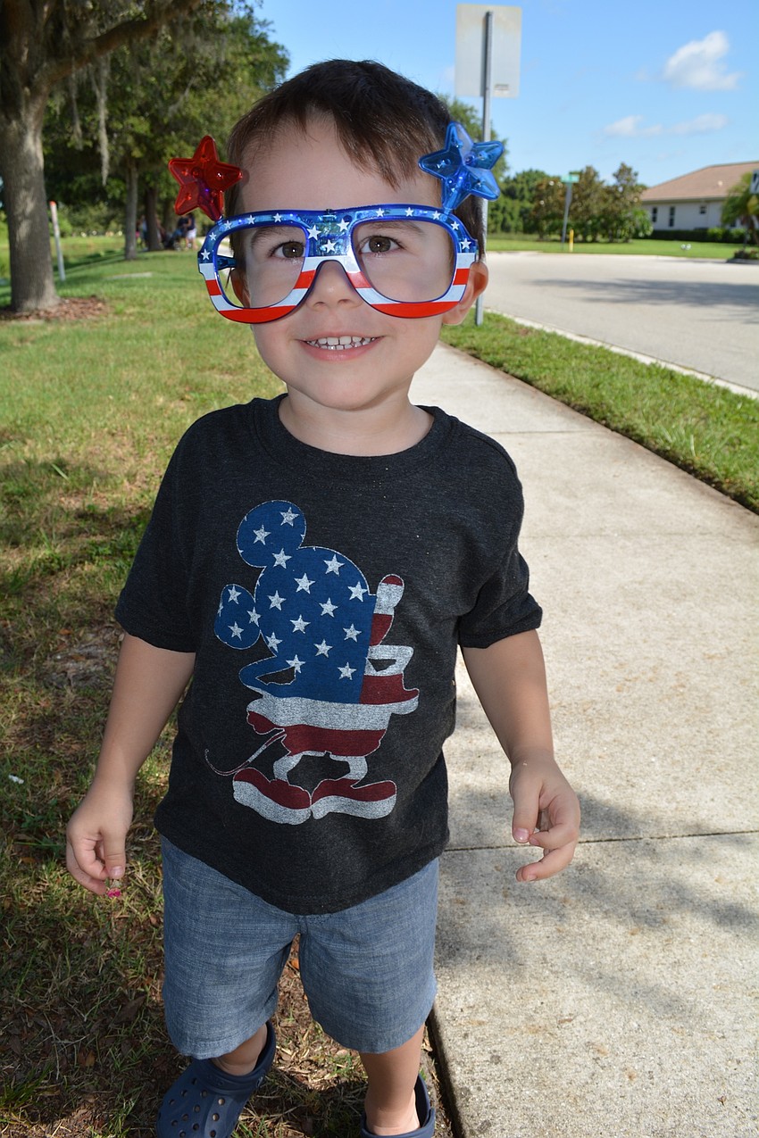 Ethan Decker, 2, shows off his light-up glasses.