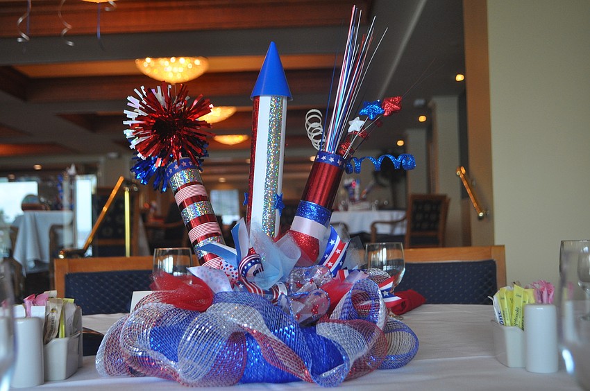 Centerpieces made out of decorated paper towel and toilet paper rolls