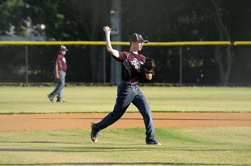 Braden River 11-and 12-year-old All-Star Max Freed tosses the ball back toward first base.