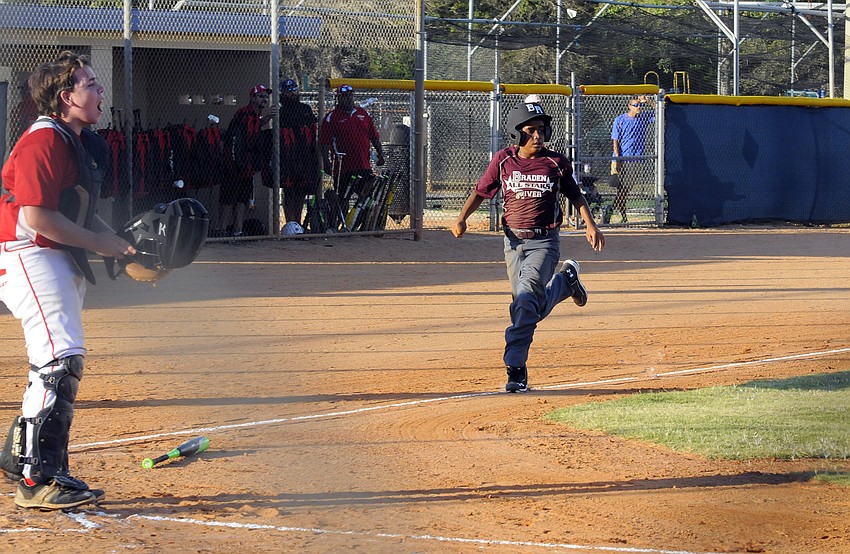 Kevin Leon scores a run for the Braden River Junior All-Stars June 29.