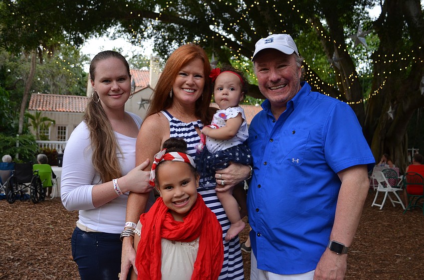 Ceara Crews with daughter Nevaeh, Terri Klauber with granddaughter Faith and Michael Klauber