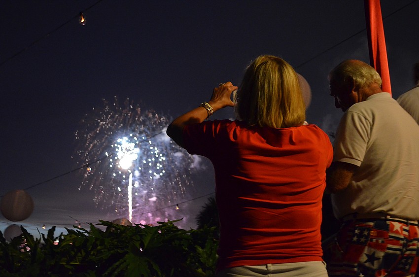 Lisa Carter captures the fireworks over Sarasota Bay from the terrace of the great room at Marie Selby Botanical Gardens.