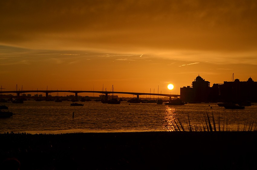 The sun setting beyond the John Ringling Bridge gave the fireworks competition for best in show Monday evening.