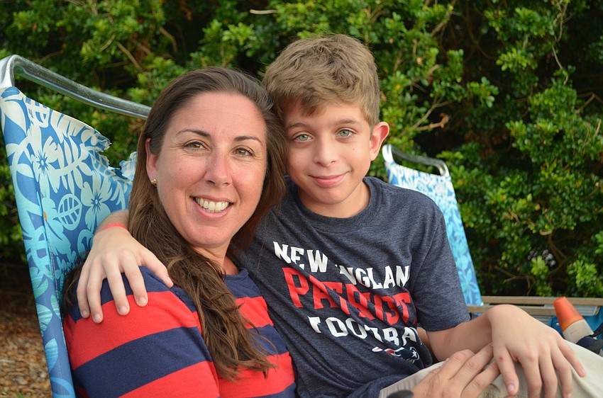 Tara and Carter Vowels picked their spots to watch the fireworks from on the lawn at Marie Selby Botanical Gardens.