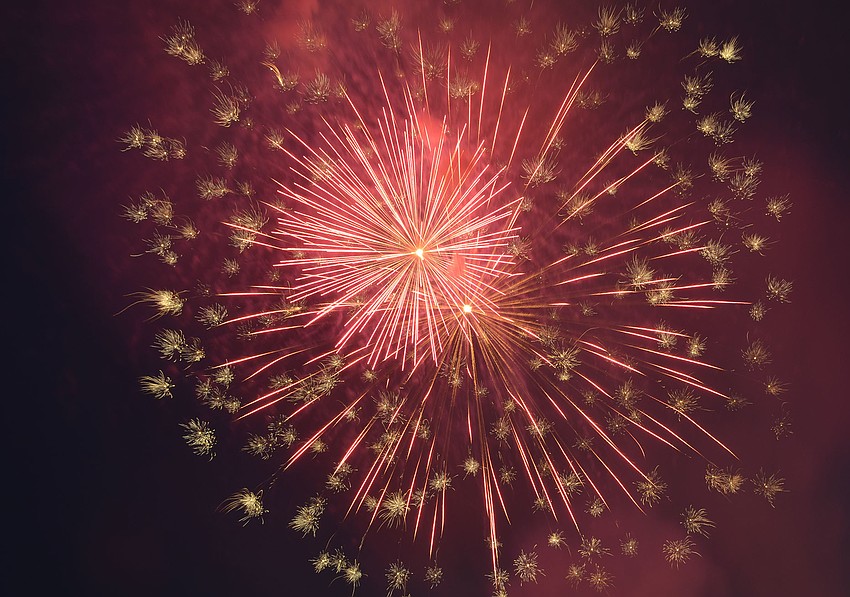 Fireworks explode over Siesta Key beach during the annual Fourth of July celebration.