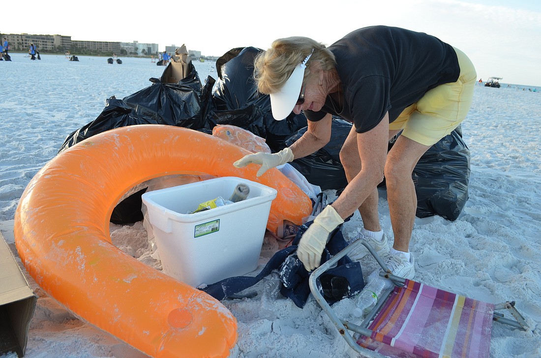 Siesta Key resident Gayle Paul helps keep her local beach clean.