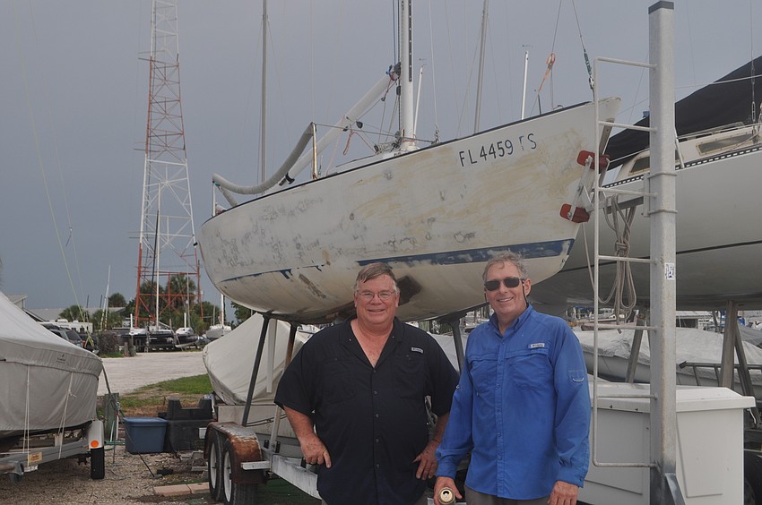 Tom Turner and Doug Dearden stand next to winning boat, In Tune