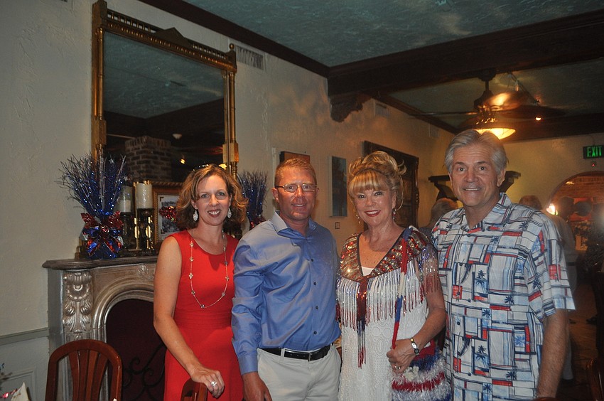 Amber Watt with husband and veteran Morgan and President of Operation Kindness Florida Joanne Forch and her husband John.