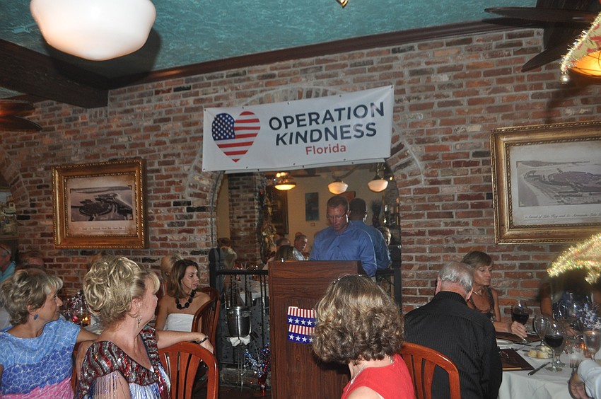 Morgan Watt speaks with the crowd about his time in the Air Force