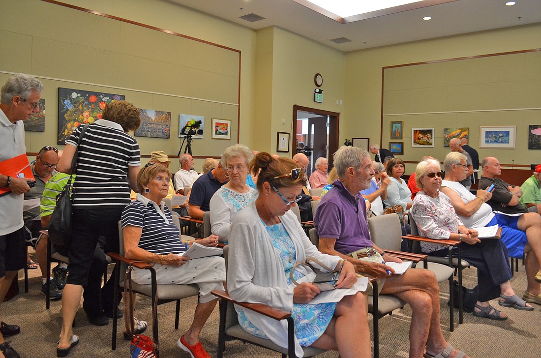 Longboat Key residents from at least a half dozen neighborhoods came to protest the proposed assessments they have to pay to underground power lines Tuesday.
