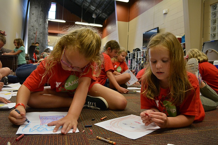 East County residents Jordyn Seacat, and Camila Correa, both 7, select coloring as their afternoon pastime.
