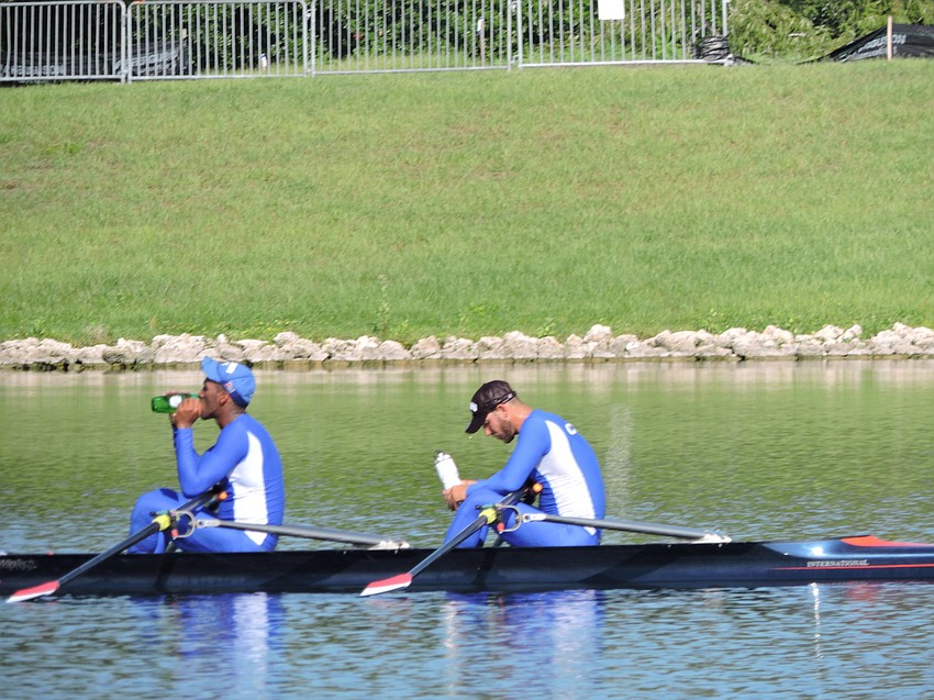 Adrian Oquendo Ibanez and Eduardo Rubio Rodriguez try to recover after a training run at Nathan Benderson Park on Friday.