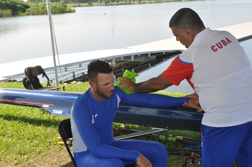 Eduardo Rubio Rodriguez gets iced by Cuban team therapist Alexaed Cabrera after a training run on Friday at Nathan Benderson Park.