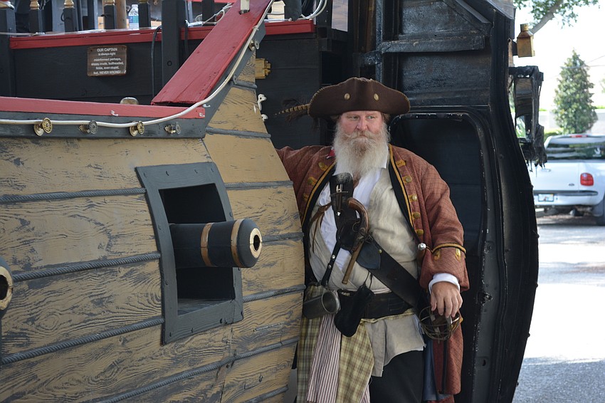 John Swager, the president of the Anna Maria Privateers, greets the children as they board.