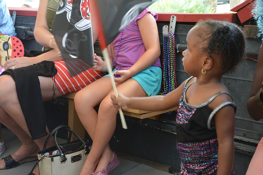 Two-year-old Marlie Haynes of Bradenton enjoys her pirate flag.