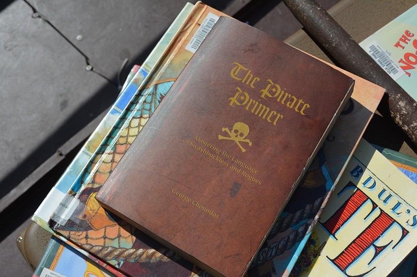 The Anna Maria Island Privateers had a stack of books ready to read to the children.