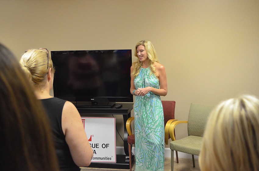 President Britt Riner explains the organization’s theme for the year; “Sow, grow, reap,” to show how JLS can help women develop as confident, giving individuals.