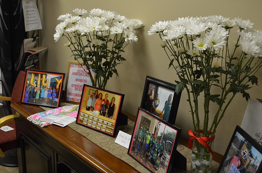 Flowers and photographs of past JLS events decorated the room.