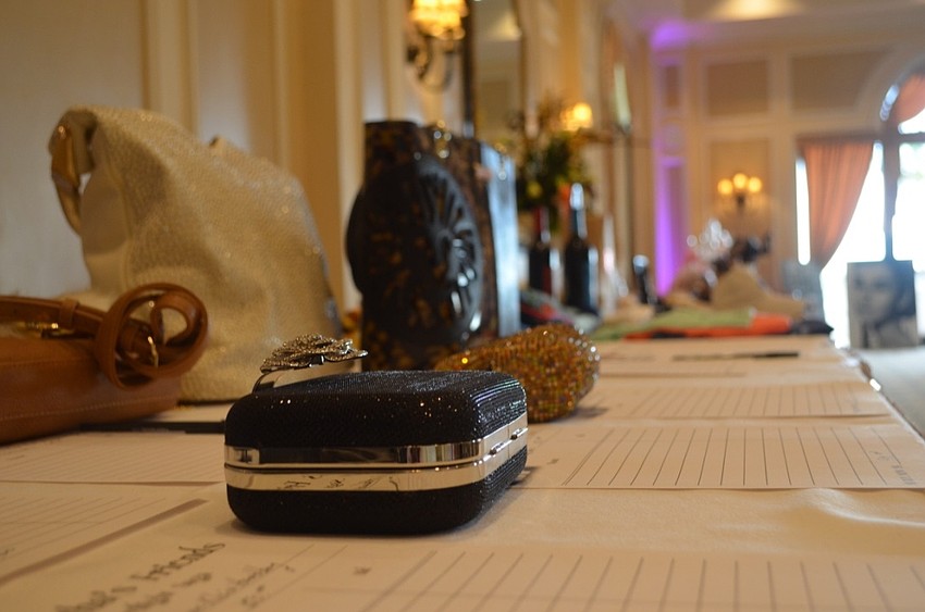 Both silent and live auction items on display to raise money for Kids and Canines, a Tampa-based non-profit that gives at-risk middle school students the opportunity to train service dogs.