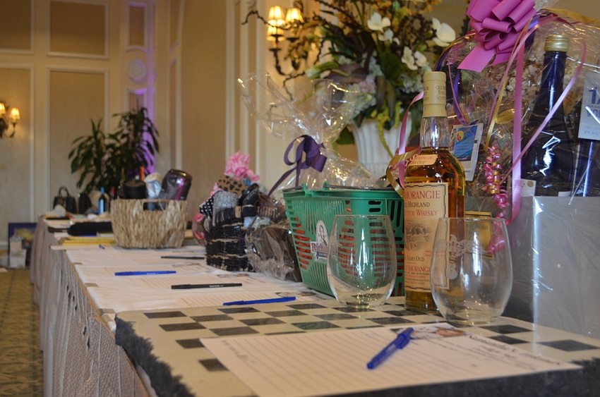 Both silent and live auction items on display to raise money for Kids and Canines, a Tampa-based non-profit that gives at-risk middle school students the opportunity to train service dogs.