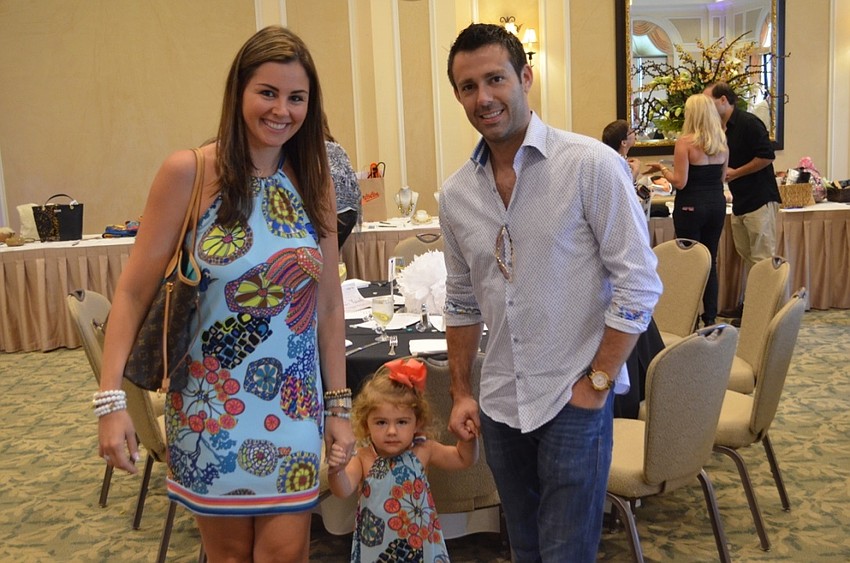 Jackie and Ansley Zumba with Brian Kins. Jackie Zumba is the owner of Jackie Z Style Co. and outfits from her St. Petersburg-based boutique were featured in the fashion show.