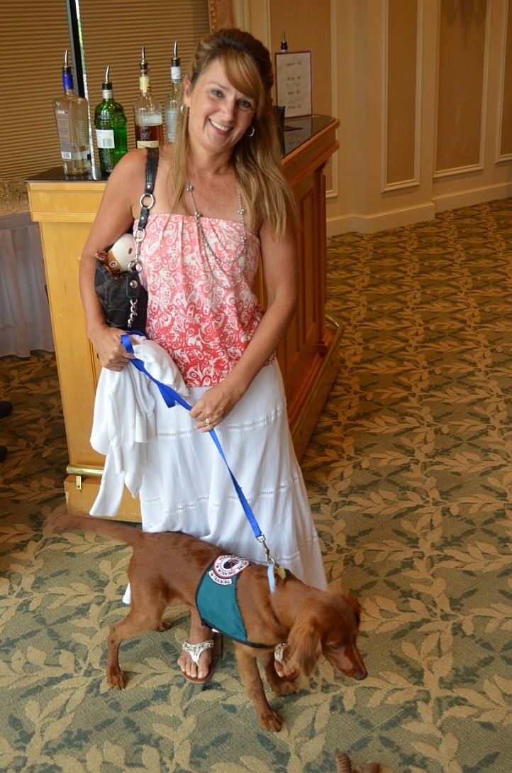 Denyce Dicaprio and Riley, a 6-month-old comfort retriever (AKA “mini golden retriever”) training to be a service dog for Kids and Canines.
