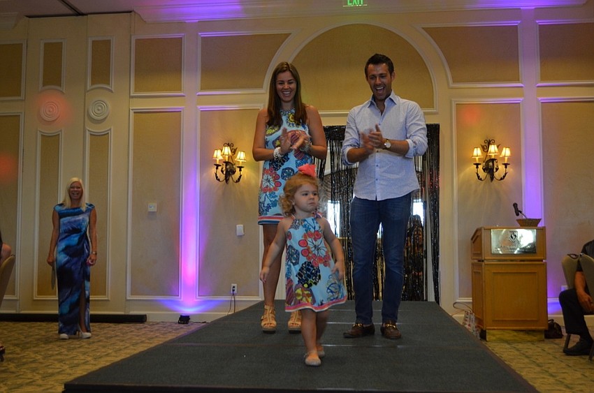 Jackie and Ansley Zumba walk the runway with Brian Kins.