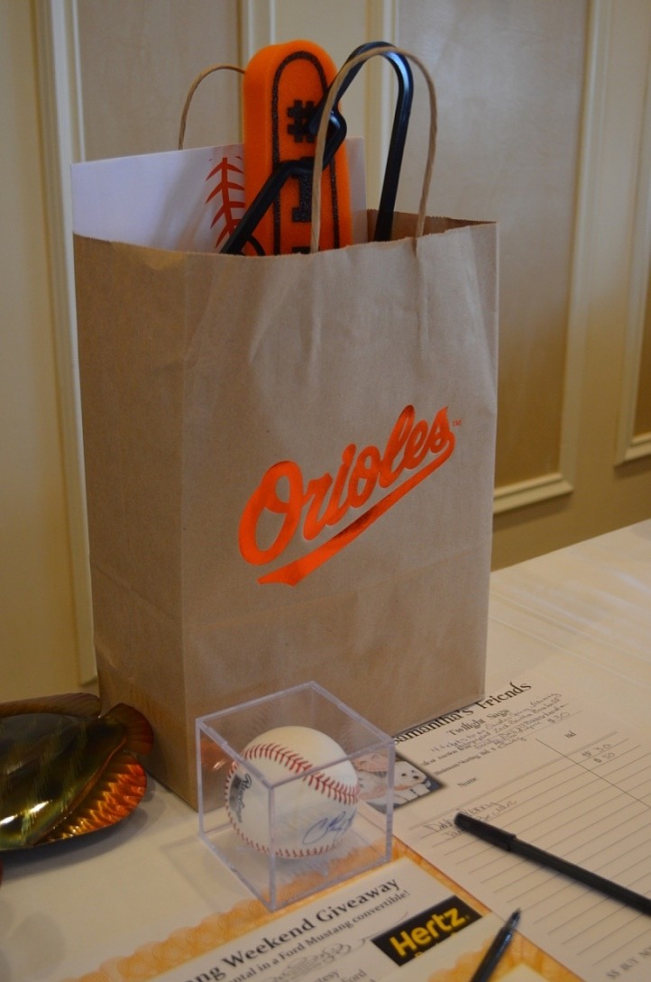 Auction items like this set of four tickets to an Orioles spring training game were bid on to raise money for Kids and Canines.