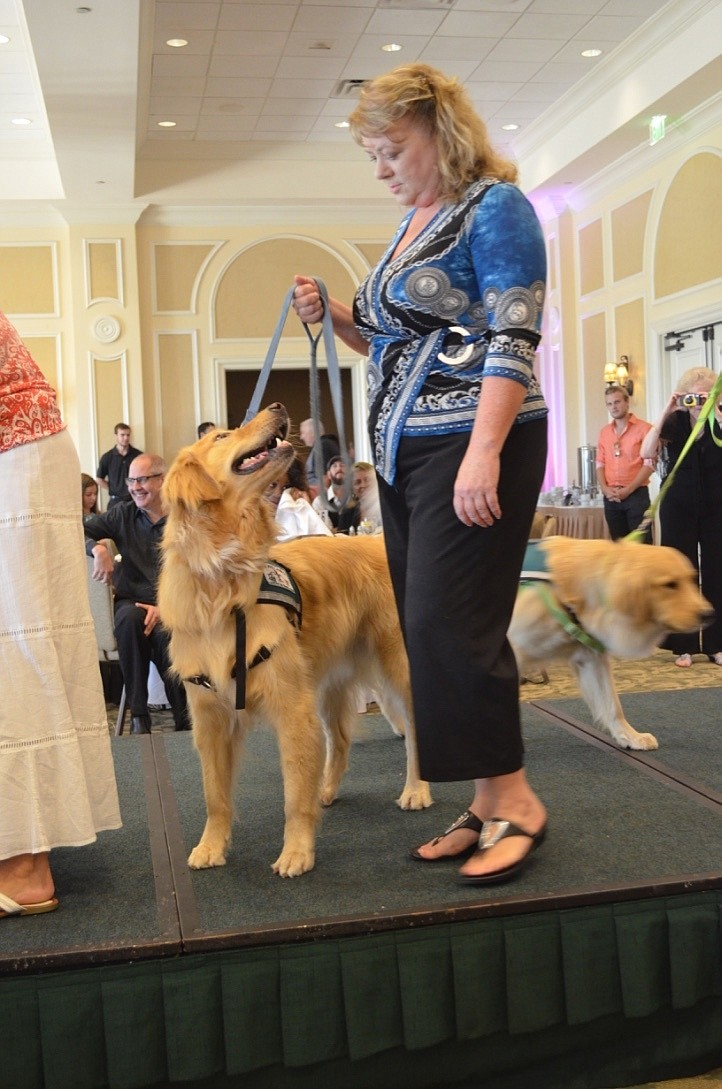 Your Observer | Photo - Angie Murray and Porter walk the runway during the  canine parade.