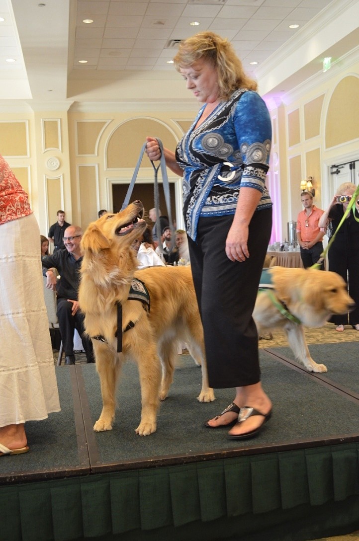 Angie Murray and Porter walk the runway during the canine parade.
