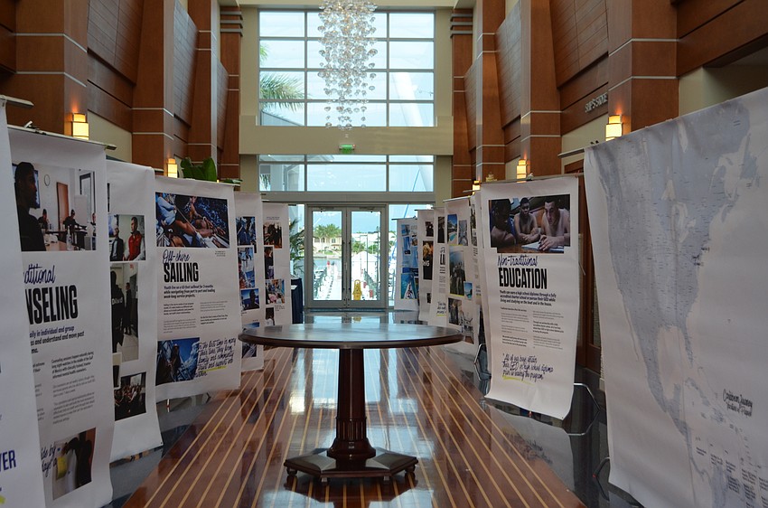 Posters with information about SailFuture lined the main hall of Sarasota Yacht Club